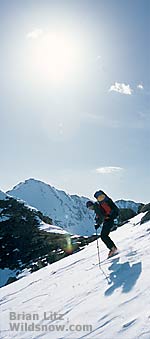 Author skiing from Continental Divide, Deer Mountain in background.