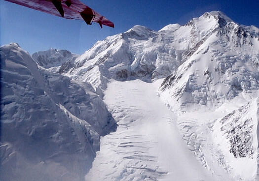 Upper Muldrow Glacier under the Harper Icefall. Karstens Ridge Coxcomb is the sharp arete to the left of the icefall. Denali summit is the farthest snow.  I was on this route in 1973 -- it's impossible to forget. To give you an idea of the scale, the head of the Muldrow is about a mile wide, elevation around 11,000 feet. Summit is 20,310 feet. You do the math.